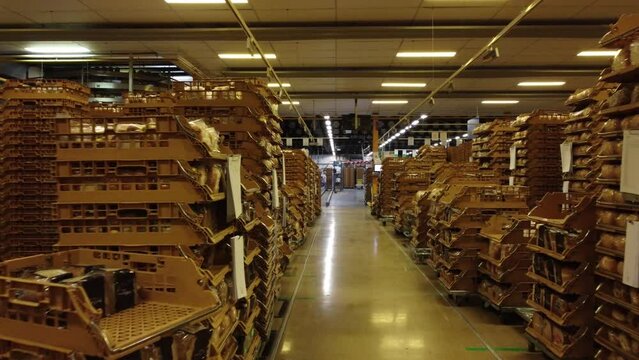 Containers with fresh baked bread in a bakery factory ready for transport, aerial