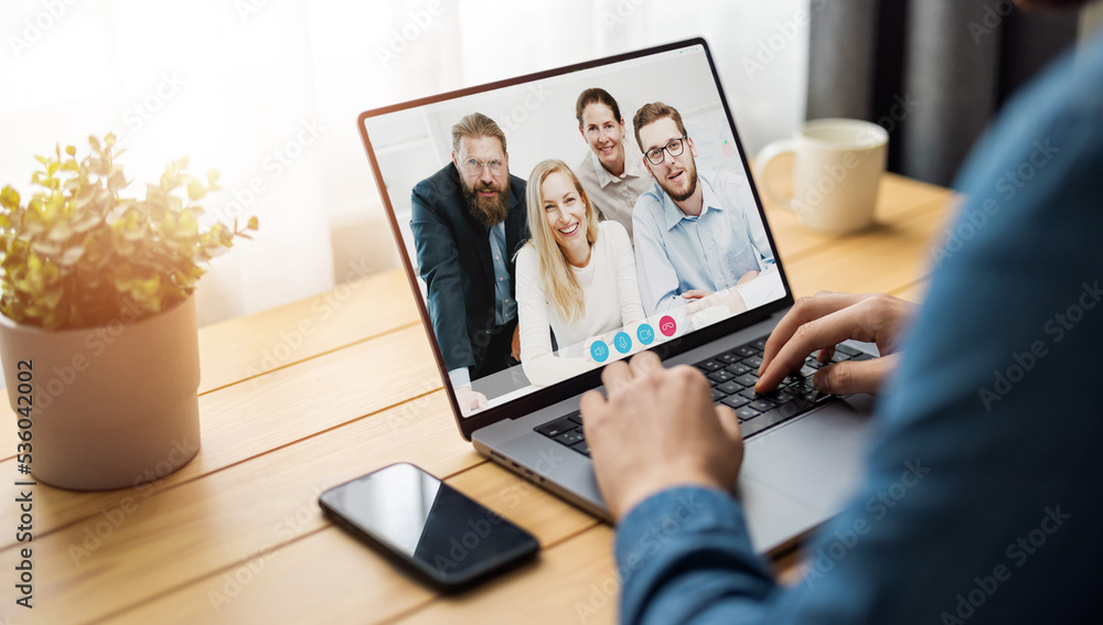 Poster laptop screen view over man shoulder at group video call. communication between business people dist