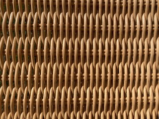a beige braided rattan pattern