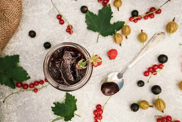 assortment of jam, seasonal berries of black, red currant, gooseberry and raspberry 7