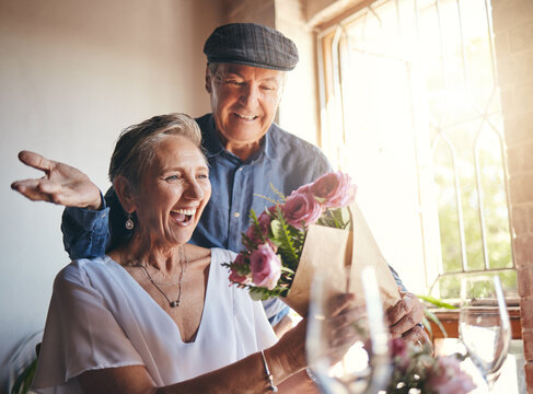 Surprise Flowers, Love Celebration And Senior Couple With Smile To Celebrate Birthday, Anniversary Or Romantic Event In Restaurant. Man And Woman Giving Bouquet Of Roses As Present Or Gift On A Date