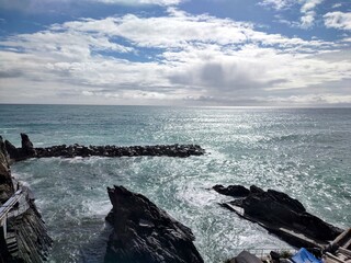 Seacoast of Cinque Terre with its villages and nature in Italy during a gloomy day of spring
