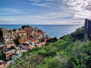 Seacoast of Cinque Terre with its villages and nature in Italy during a gloomy day of spring