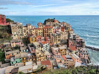 Fototapeta na wymiar Seacoast of Cinque Terre with its villages and nature in Italy during a gloomy day of spring