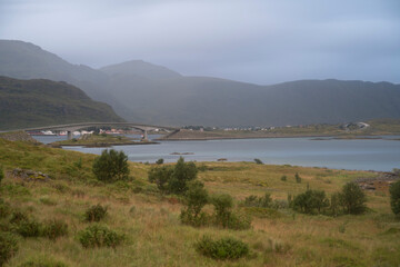 landscape view of a village in the fiords of Lofoten Islands, Norway on a cloudy day