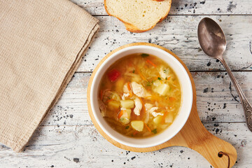 Chicken soup with fresh cabbage, flatlay