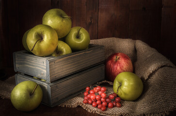 Apples and other foods on a dark wooden background