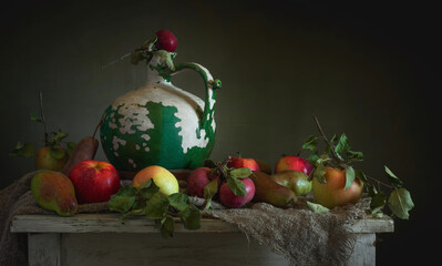 Old ceramic jug and ripe apples.
