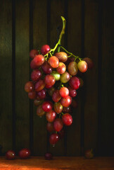 Still life with a bunch of ripe and tasty grapes.