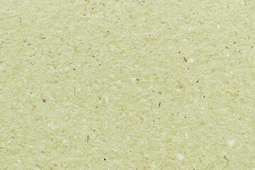 A sheet of light green recycled craft paper texture as background
