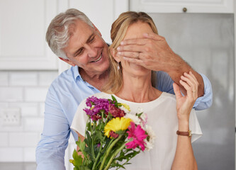 Senior couple covering eyes for flowers surprise, anniversary love and valentines day in New Zealand home. Happy man giving bouquet to woman for birthday gift, present and celebrate romance together