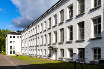 Fototapeta na wymiar Kornelimünster near Aachen, Germany. View of the former Rohland textile factory (old bailiwick with forced mill).