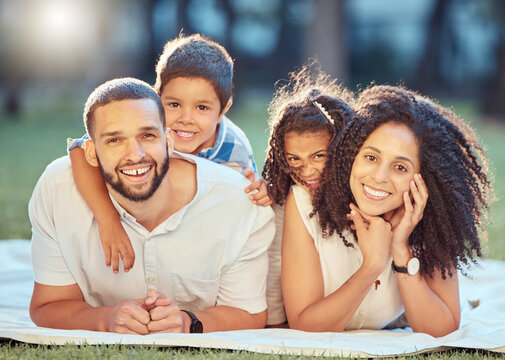 Family, Children And Smile On Grass For Portrait On Blanket To Relax Show Love, Care And Happiness. Black Mom, Dad And Kids On Picnic In Park, Garden Or Backyard Smile Together In Sunshine In Toronto