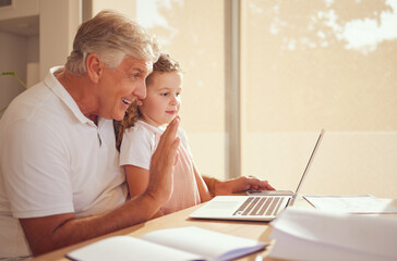 Elderly man, laptop and child on video call speaking and waving while relaxing in the family home. Happy, smile and grandfather and little girl greeting on a virtual call with a computer in the house