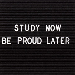 Motivational quote on black letter board. Study now be proud later. Inspirational quote of the day.