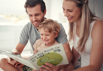 Parents, child and reading dinosaur books in family home for educational fun, learning and happy...