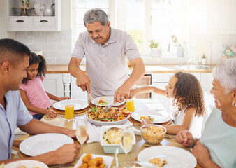 Family lunch, home celebration and grandparents hosting a dinner at kitchen table for children with...