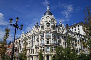 Exterior view of historical buildings in Madrid, Spain, Europe. Mediterranean streets characterized by elegance, and discreet exclusivity, in the traditional Austrias old town neighborhood.