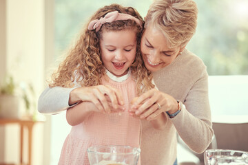 Children, family and baking with a girl learning and grandmother cooking in a kitchen of their home together. Kids, food and ingredients with a senior woman teaching her granddaughter to make a meal