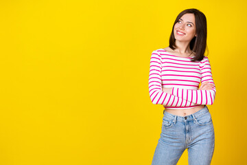 Portrait of young attractive businesswoman looking empty space recommend new menu her cafe isolated on yellow color background