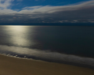Fototapeta na wymiar Moon reflecting on the Atlantic Ocean