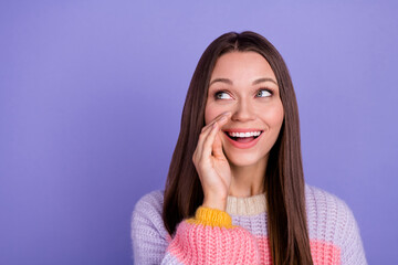 Photo of gorgeous pretty girlish woman with long hairdo dressed striped sweater look empty space share news on violet color background