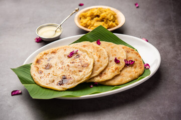 Puran poli, Puran roti, Holige, Obbattu, or Bobbattlu, is Indian sweet flatbread from Maharashtra - obrazy, fototapety, plakaty