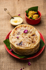 Puran poli, Puran roti, Holige, Obbattu, or Bobbattlu, is Indian sweet flatbread from Maharashtra