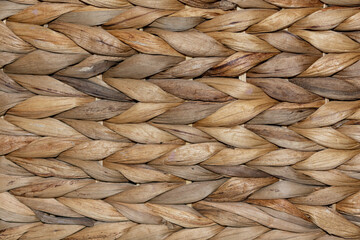 Close-up wicker basket texture. Natural fibers. Wide weave.