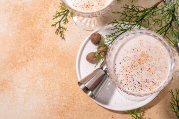 Boozy creamy Brandy Alexander Cocktail with nutmeg. Trendy autumn winter alcohol drink 