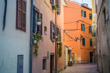 Fototapeta na wymiar beautiful streets of the old town of Rijeka. Old houses, restaurants, narrow streets in the historic city