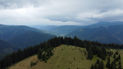 Obraz premium Panorama of the mountains. Rainy sky. Beautiful panorama of the autumn Carpathian maountains.
