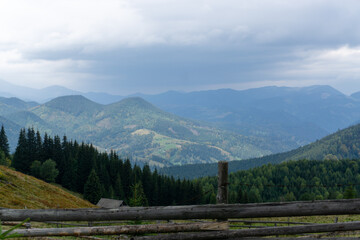 Fototapeta na wymiar Panorama of the mountains. Rainy sky. Beautiful panorama of the autumn Carpathian maountains.