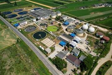 Aerial panorama view over a wastewater treatment plant for sewage cleaning
