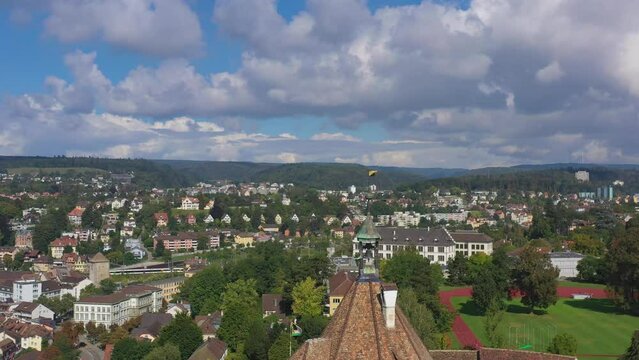 Pullback aerial drone shot from the flag above Munot fortress in Schaffhausen, Switzerland
