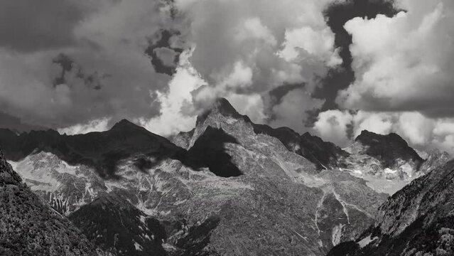 The Olan peak in the Ecrins National Park with passing clouds (time-lapse in Black & White). Major peak of the GR54 Ecrins Massif hiking tour. Valgaudemar Valley, Hautes-Alpes, French Alps, France