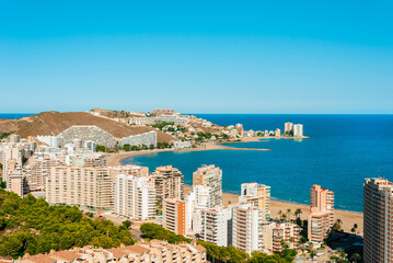 Fototapeta premium View on a small touristic town on a seashore from the top of a mountain