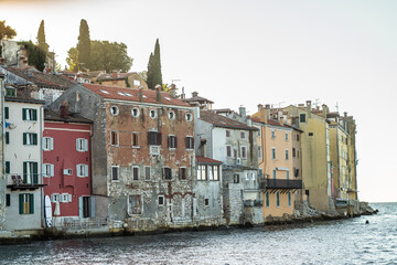 old, historic buildings of the historic old town of Rijeka from the sea at sunset