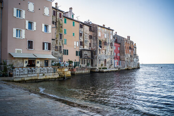 old, historic buildings of the historic old town of Rijeka from the sea at sunset