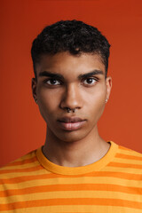 Young black man with piercing posing and looking at camera