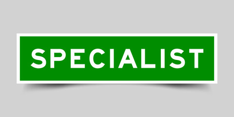 Sticker label with word specialist in green color on gray background