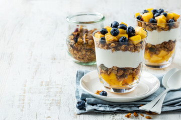 Greek yogurt, granola, mango and blueberries dessert