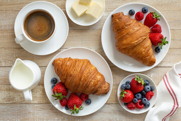 Freshly baking croissant with fresh berries