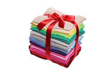 Stack of ironed and packed clothes wrapped with a red ribbon