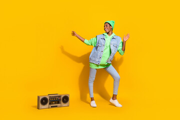 Fototapeta na wymiar Full size portrait of energetic cheerful person enjoy pastime dj boom box isolated on yellow color background