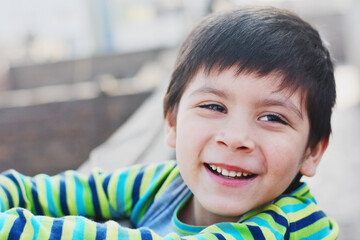 Happy latin 6 years old boy.