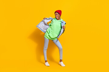 Full length body size view of attractive cheerful funky girl enjoying having fun dancing isolated over bright yellow color background