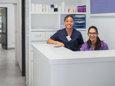 Cheerful Receptionists Behind Counter