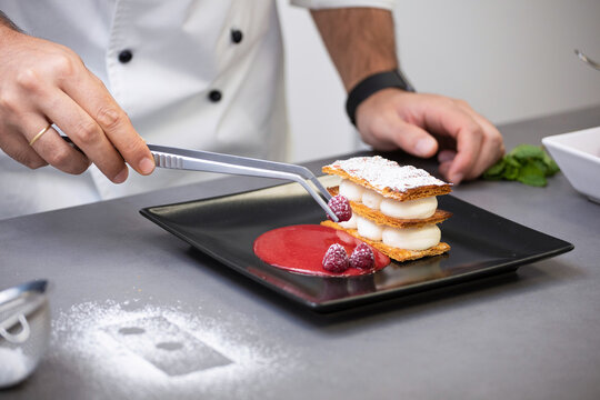 Professional chef serving dessert