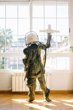 Adorable kid with a real astronaut uniform